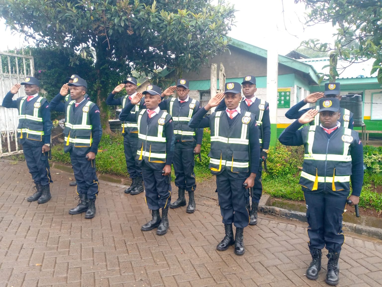 Sasova Security officers saluting in formation